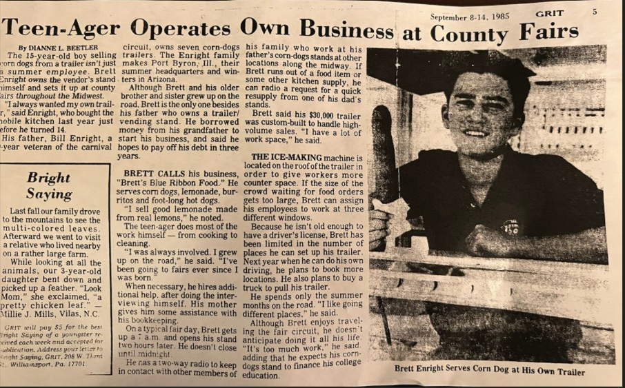 Original 1985 newspaper clipping showing 15-year-old Brett Enright serving a corn dog from his own trailer